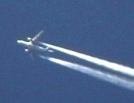 A trans-Atlantic airliner passing overhead, filmed on video camera by the author